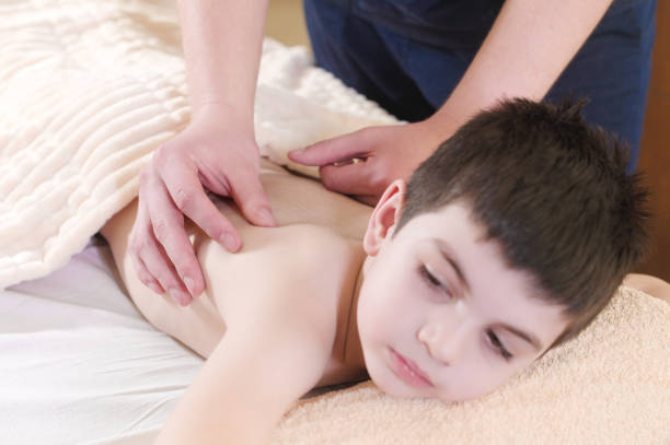 istock A little boy relaxes from a therapeutic massage 1150781145