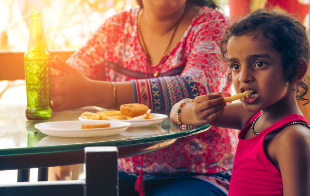 istock Mother and daughter in restaurant 1150783227