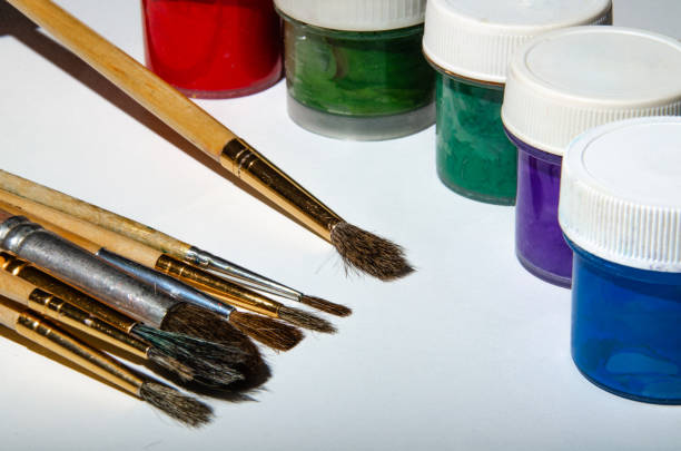 istock Paint brushes for different sizes and colors. White table. Macro. 1150783239