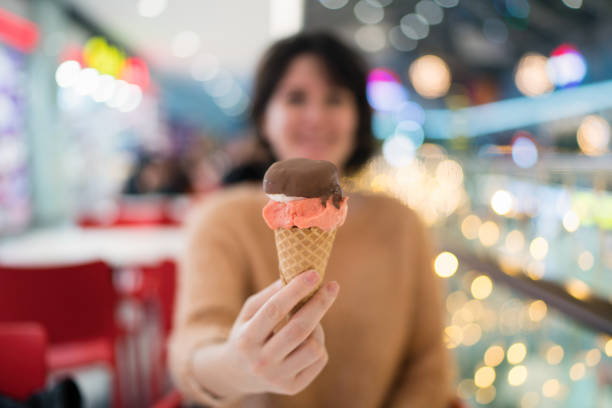 istock Woman eating ice cream 1150785039