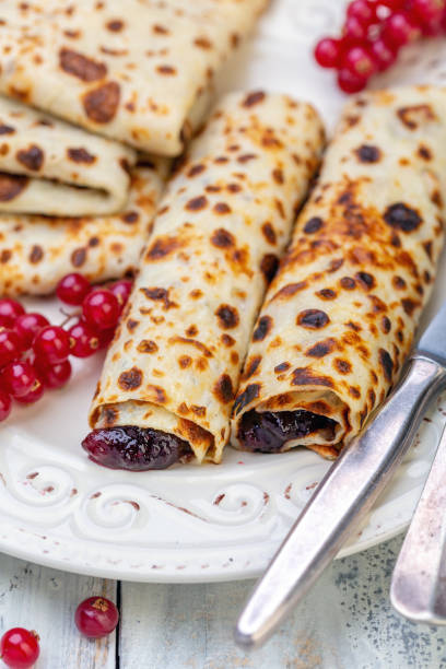 istock Norwegian pancakes stuffed with berry jam. 1150785242