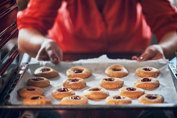istock Preparing Peanut Butter Cookies with Marmalade in Domestic Kitchen 1150785287