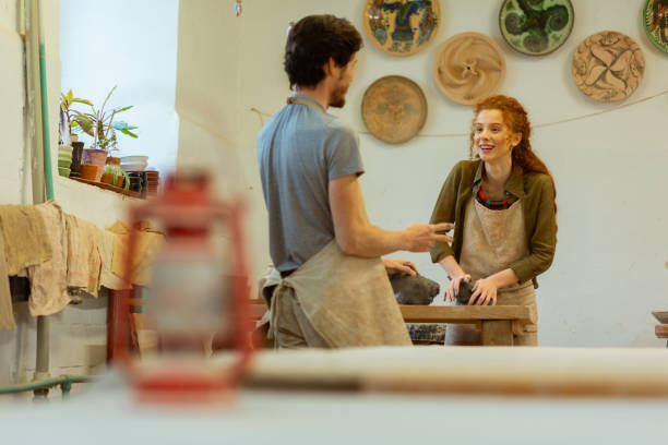istock Talkative pleasant colleagues being kind to each other 1150786280