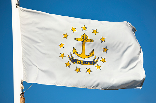 State flag of Rhode Island USA flies in the wind in Providence