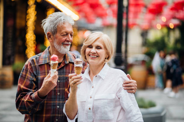 istock Couple hugging and having ice-cream 1150787099