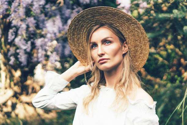 istock sad girl in straw hat 1150787767
