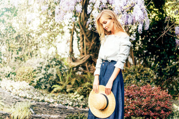 istock Thoughtful woman with a hat in her hands 1150787772