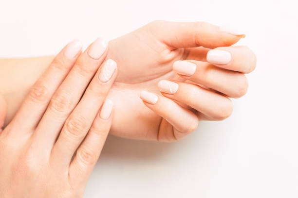 istock Beautiful female hands with stylish professional manicure. 1150787996