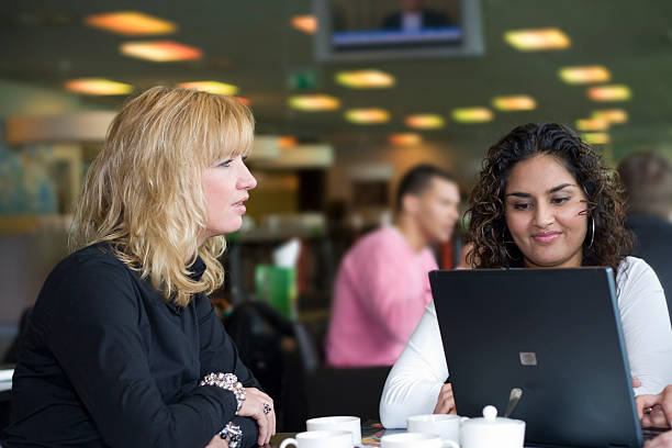 istock Two business woman in a meeting 115078885