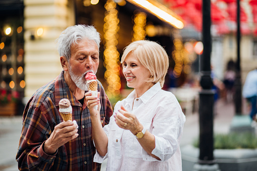 Older people eating ice cream outdoors