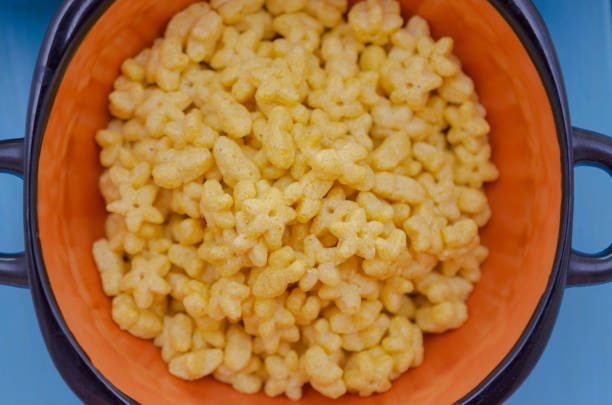 istock Corn cups with breakfast cereals on blue wooden background. 1150789553