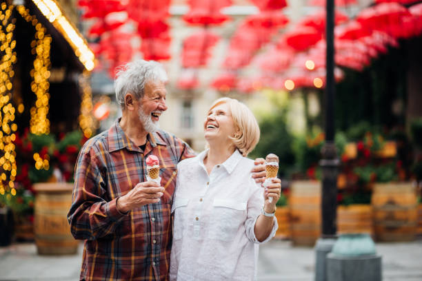 istock Couple eating ice-cream and smiling 1150790578