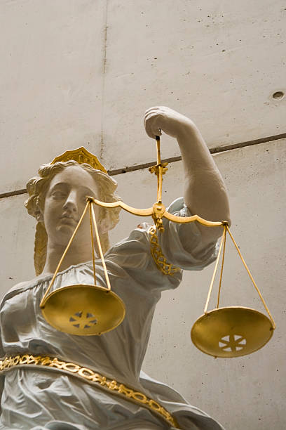 istock Lady Justice holding scales 115079132