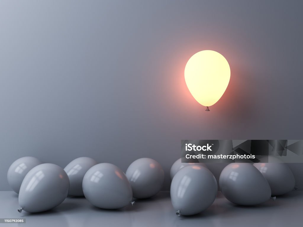 Stand out from the crowd and different concepts One light balloon glowing and floating above other white balloons on white wall background with window reflections and shadows 3D rendering Individuality Stock Photo