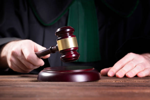 istock judge hits the gavel and pronunces final judgement 1150794780