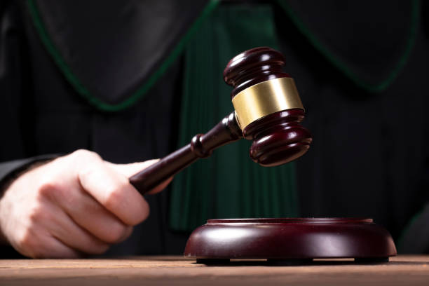 istock judge hits the gavel and pronunces final judgement 1150794884