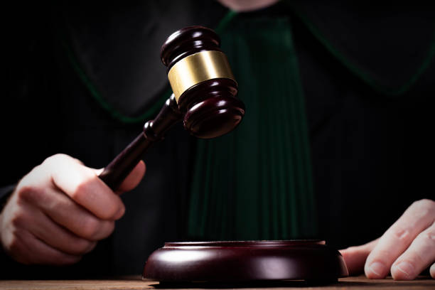 istock judge hits the gavel and pronunces final judgement 1150794919