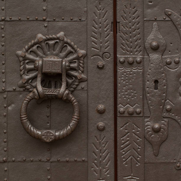 Forged antique metall door beautiful antique metal door with a handle and a lock, very strong and reliable riveting stock pictures, royalty-free photos & images