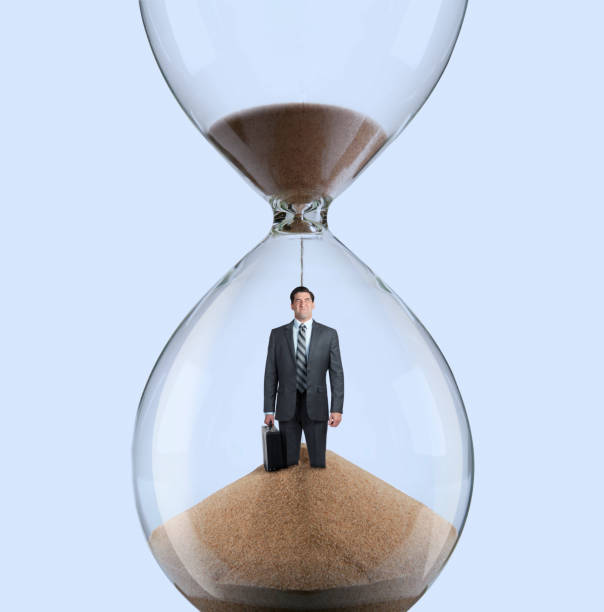 istock Businessman Inside An Hourglass 1150796569