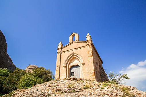 Sant Joan chapel in the mountains of Montserrat Monastery, Catalonia, Barcelona, Spain Sunny day, blue sky