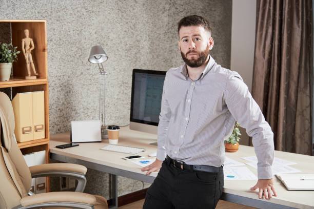 istock Young businessman standing at office 1150798837