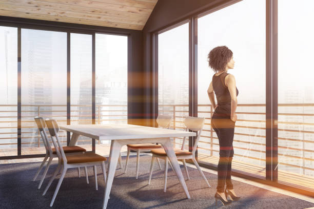 istock African American woman in panoramic dining room 1150800242
