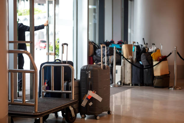 Luggage in hotel lobby Luggage waiting in hotel lobby airport porter stock pictures, royalty-free photos & images