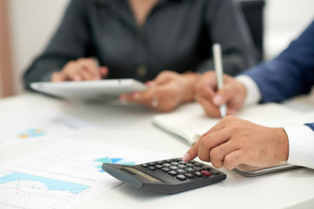 istock Business people calculating incomes 1150803929