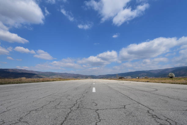 Old wide straight asphalt road