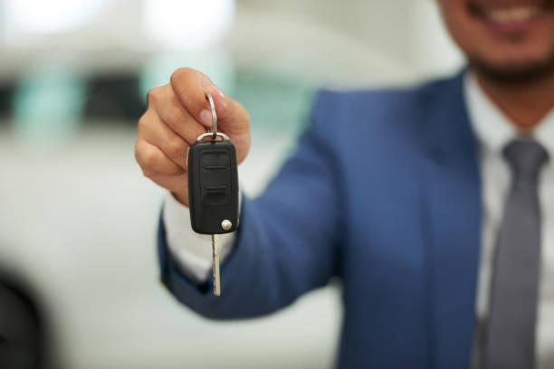 istock Businessman with car key 1150804052