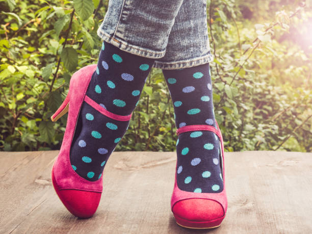 istock Women's legs, bright socks. Concept of Style 1150804205