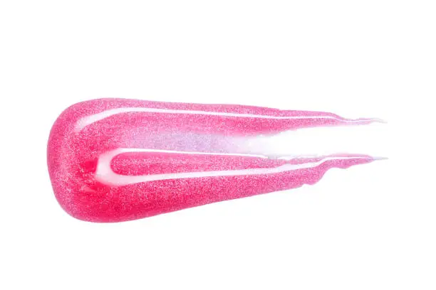 Lip gloss sample isolated on white. Smudged pink lipgloss.