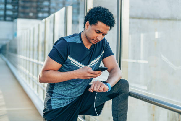 istock Sportsman checking his smart watch 1150806291