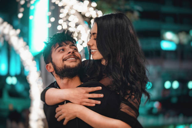 istock Young handsome man carrying his beautiful girlfriend 1150806815