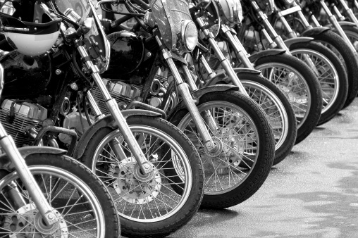 A row of police motorcycles at a protest rally. 