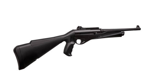 istock Modern black shotgun isolate on white background. Black semi-automatic shotgun on a light background. 1150807705