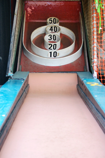 Skeeball (Roll the ball so it jumps into the points, an arcade / carnival game)