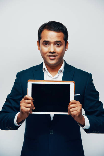 istock Businessman showing display of tablet pc 1150812674