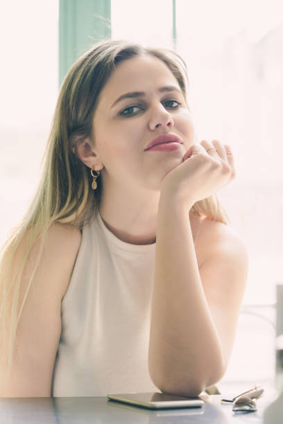 istock Beautiful woman in a cafe 1150818524