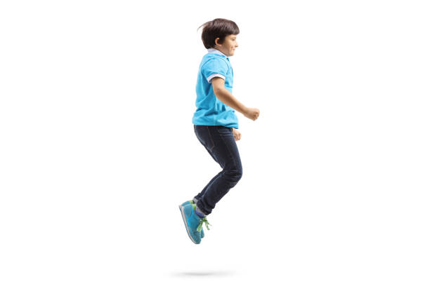 happy boy jumping - junior high fotos imagens e fotografias de stock