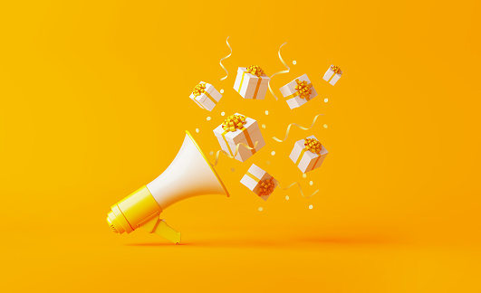 istock Gift Boxes Coming Out of A Yellow Megaphone over Yellow Background 1150831616