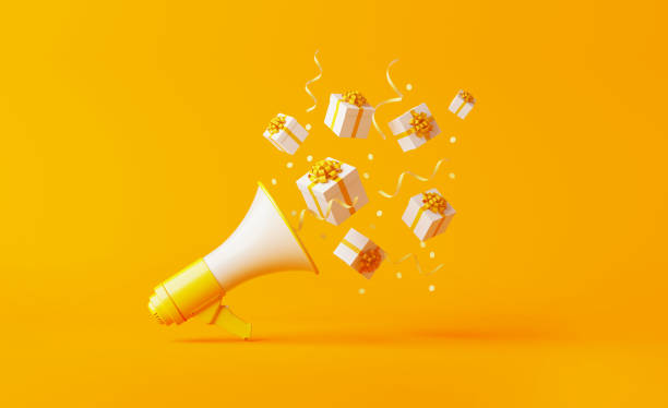 Gift Boxes Coming Out of A Yellow Megaphone over Yellow Background Gift boxes coming out of a yellow megaphone over yellow background. Horizontal composition with copy space. Great use for announcement concepts. announcement message photos stock pictures, royalty-free photos & images
