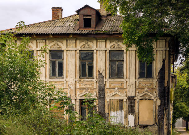 Facade of an abandoned old house. stock photo