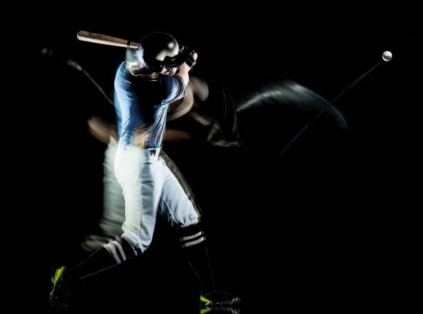 baseball player man isolated black background light painting one caucasian baseball player man  studio shot isolated on black background with light painting speed effect baseball hitter stock pictures, royalty-free photos & images