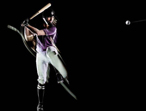 istock baseball player man isolated black background light painting 1150834733