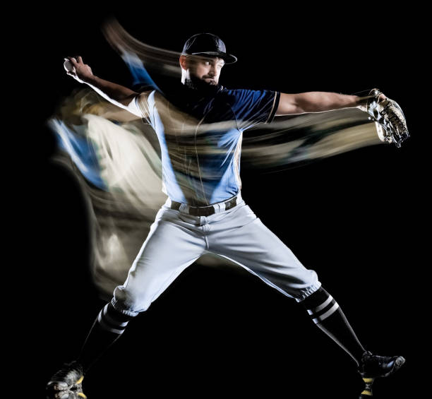 istock baseball player man isolated black background light painting 1150834736