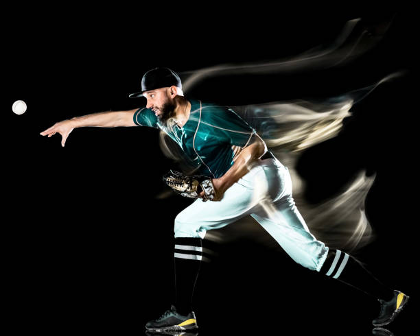 istock baseball player man isolated black background light painting 1150834740