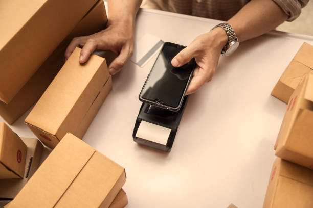 istock Man hand holding credit card reader nfc tecnology money machine. 1150834860