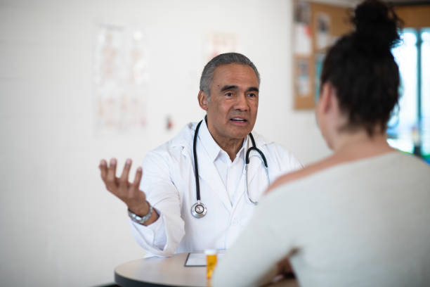 istock Male doctor talking to his patient 1150835044