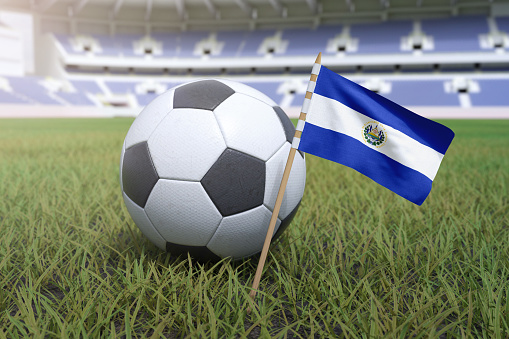 El Salvador flag in stadium field with soccer football